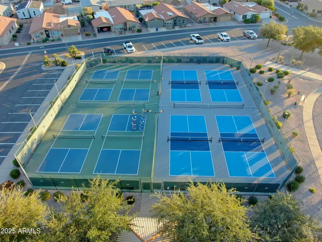 an aerial view of residential houses with outdoor space