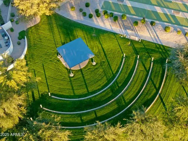 an aerial view of a house with a yard