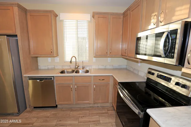 a kitchen with a stove and a microwave