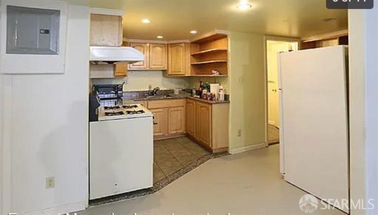 9 Grace Street San Francisco, CA 94103 - Photo 21 of 29 a kitchen with stainless steel appliances granite countertop a refrigerator a stove a sink and white cabinets