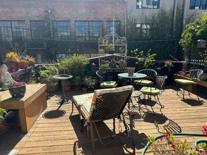 a view of a table and chairs in patio