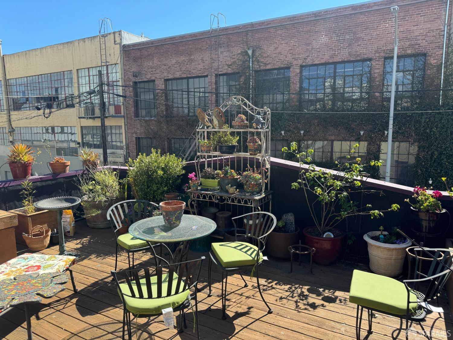 9 Grace Street San Francisco, CA 94103 - Photo 6 of 29 a patio with table and chairs potted plants