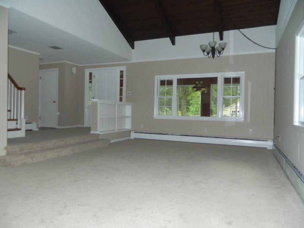 144 Country Club 3 Road Sanford, ME 04073 - Photo 7 of 35 Front to back living room provides...