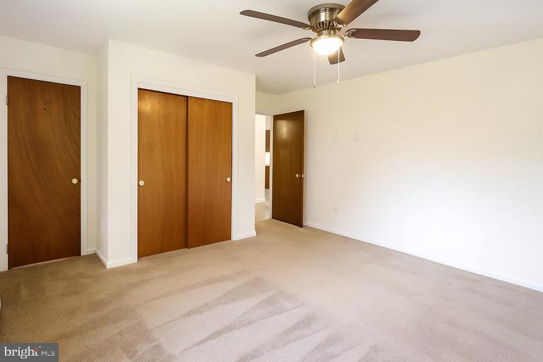 12102 Lucasville Road Manassas, VA 20112 - Photo 13 of 22 a view of empty room with a ceiling fan
