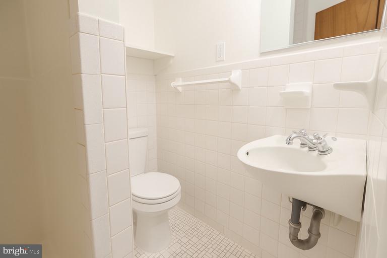 12102 Lucasville Road Manassas, VA 20112 - Photo 18 of 22 a bathroom with a sink a toilet and a mirror