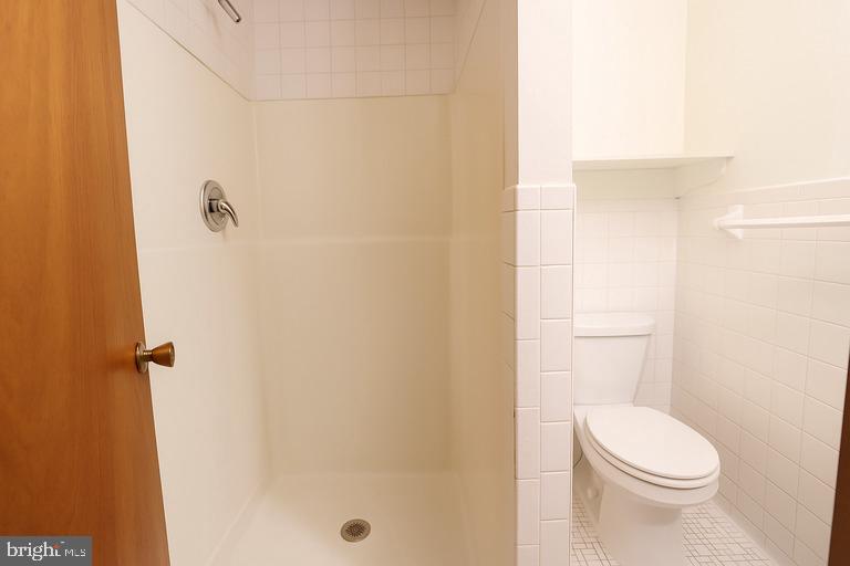12102 Lucasville Road Manassas, VA 20112 - Photo 19 of 22 a white toilet sitting next to a shower