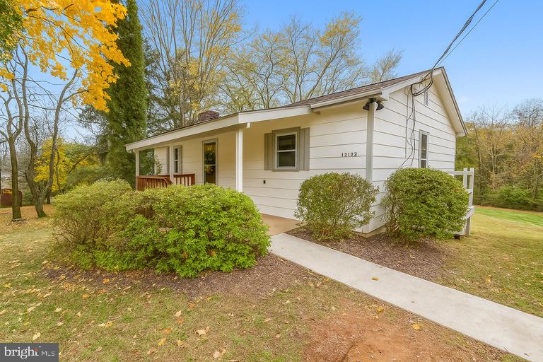 12102 Lucasville Road Manassas, VA 20112 - Photo 3 of 22 a view of a house with a yard