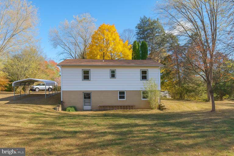 12102 Lucasville Road Manassas, VA 20112 - Photo 4 of 22 a view of a house with a yard