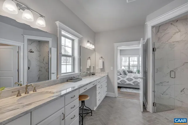 a spacious bathroom with a granite countertop sink mirror and