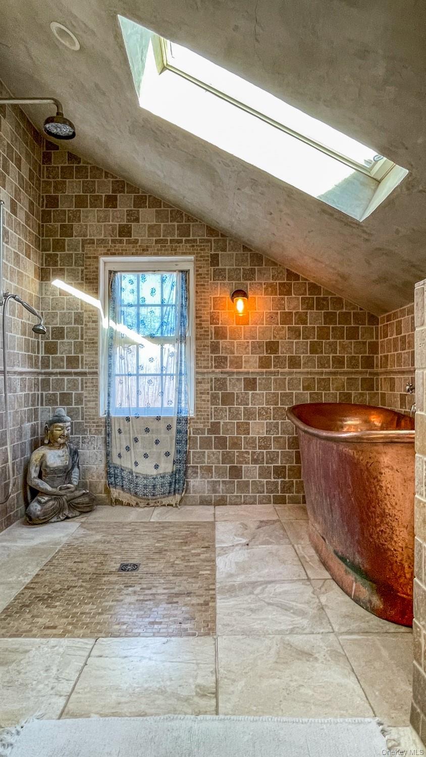 1201 Bruynswick Road Gardiner, NY 12525 - Photo 18 of 45 a bathroom with sink window and glass door