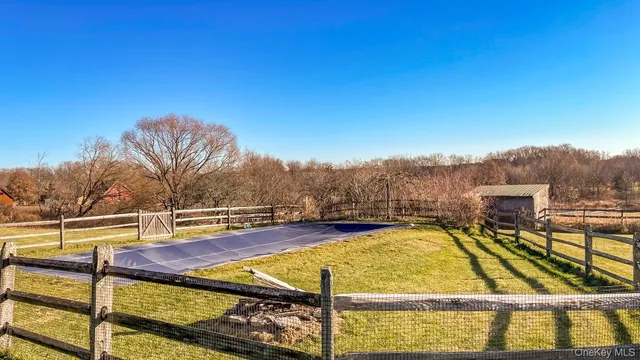 a view of a swimming pool with seating area