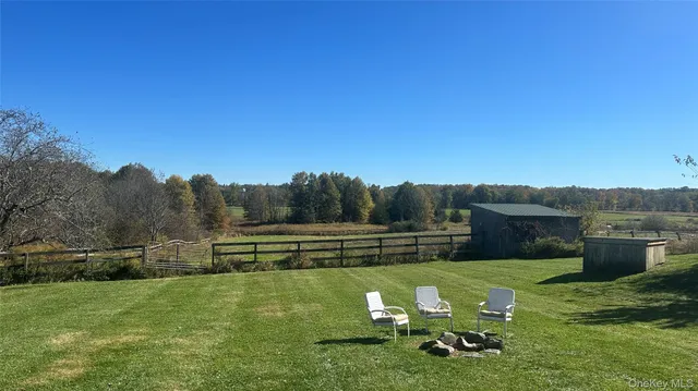 a view of a garden with sitting area
