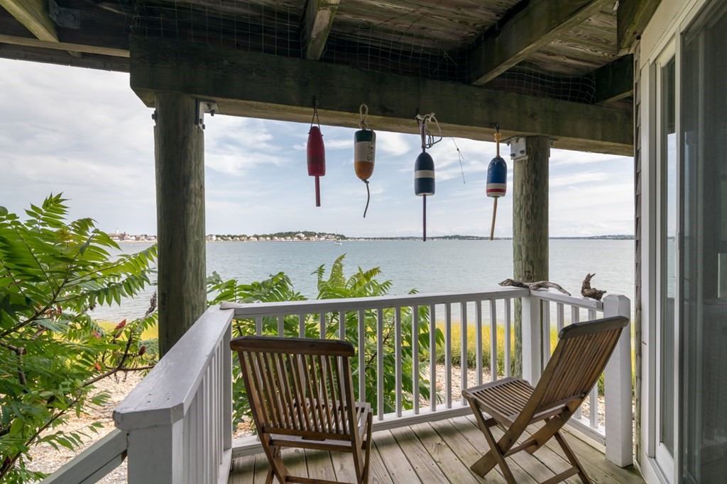 a view of a balcony with furniture