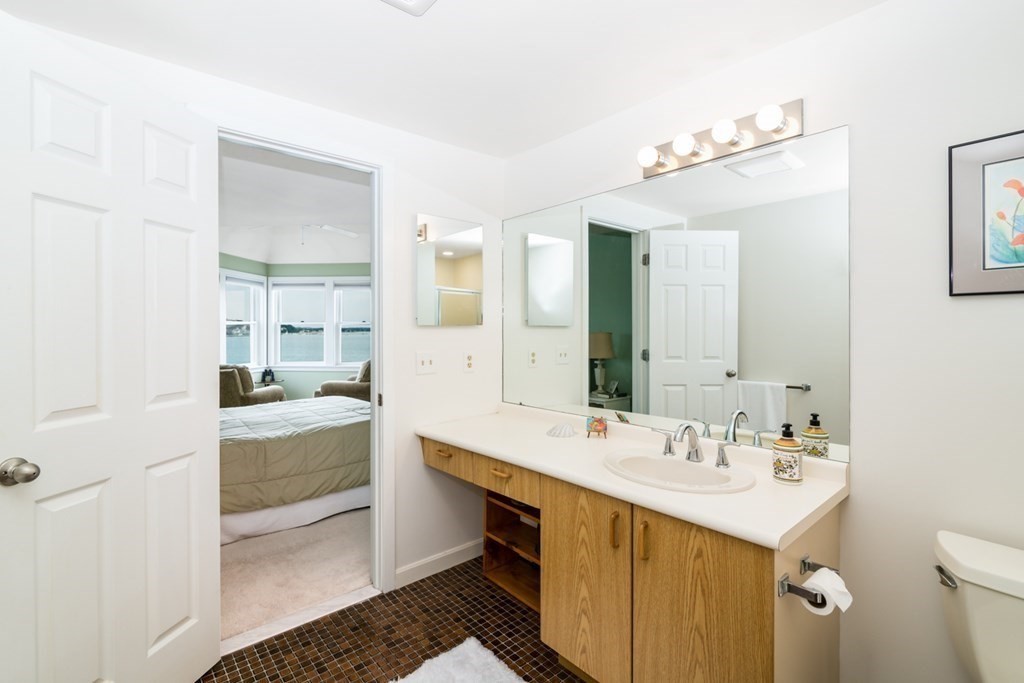 16 Marina Drive, Unit 16 Hull, MA 02045 - Photo 11 of 22 a bathroom with a sink double vanity and a mirror