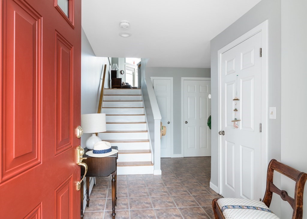 16 Marina Drive, Unit 16 Hull, MA 02045 - Photo 2 of 22 a view of a hallway with chairs and a potted plant