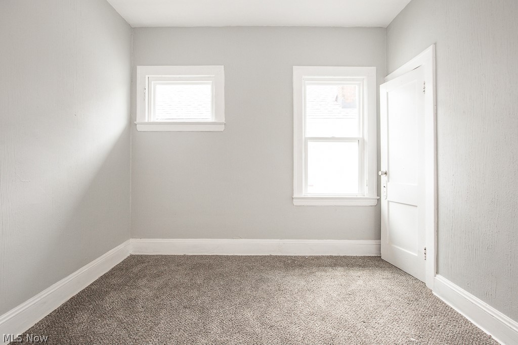 1000 Eddy Road Cleveland, OH 44108 - Photo 31 of 38 Empty room featuring light carpet and baseboards