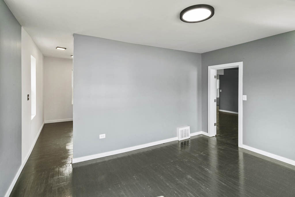 444 West Indiana Avenue Beecher, IL 60401 - Photo 11 of 20 an empty room with wooden floor and windows