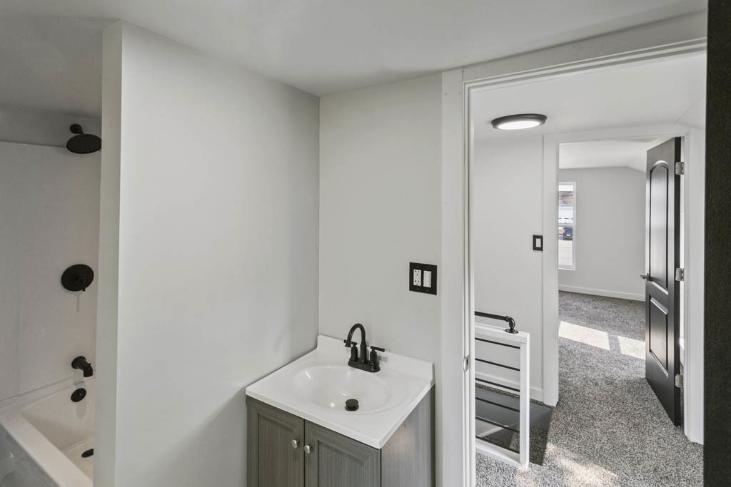 444 West Indiana Avenue Beecher, IL 60401 - Photo 18 of 20 a bathroom with a sink mirror and shower
