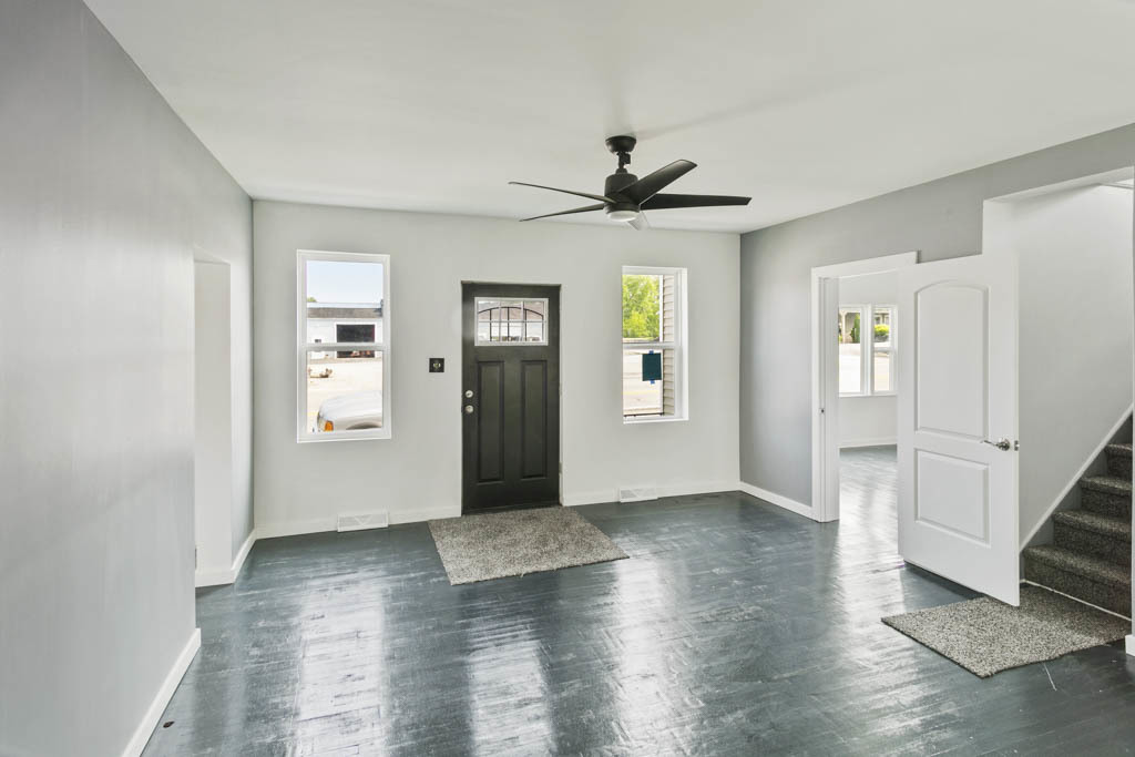 444 West Indiana Avenue Beecher, IL 60401 - Photo 7 of 20 a view of an empty room with window and wooden floor