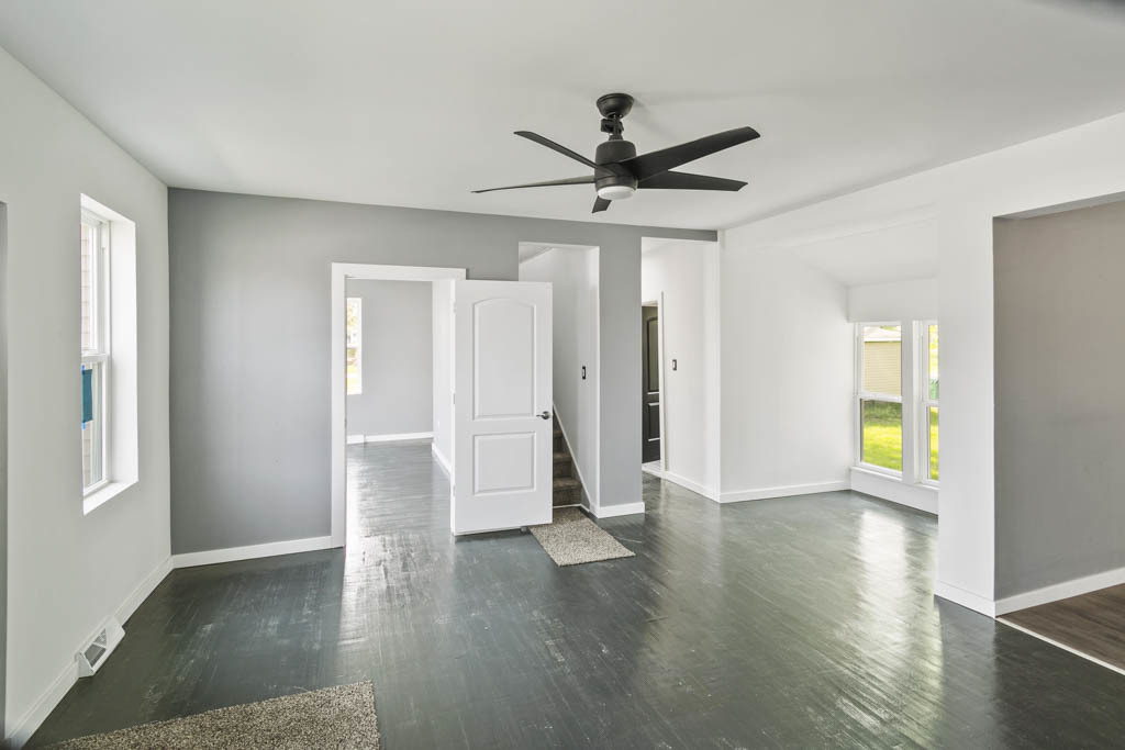 444 West Indiana Avenue Beecher, IL 60401 - Photo 8 of 20 a view of an empty room with wooden floor and a window