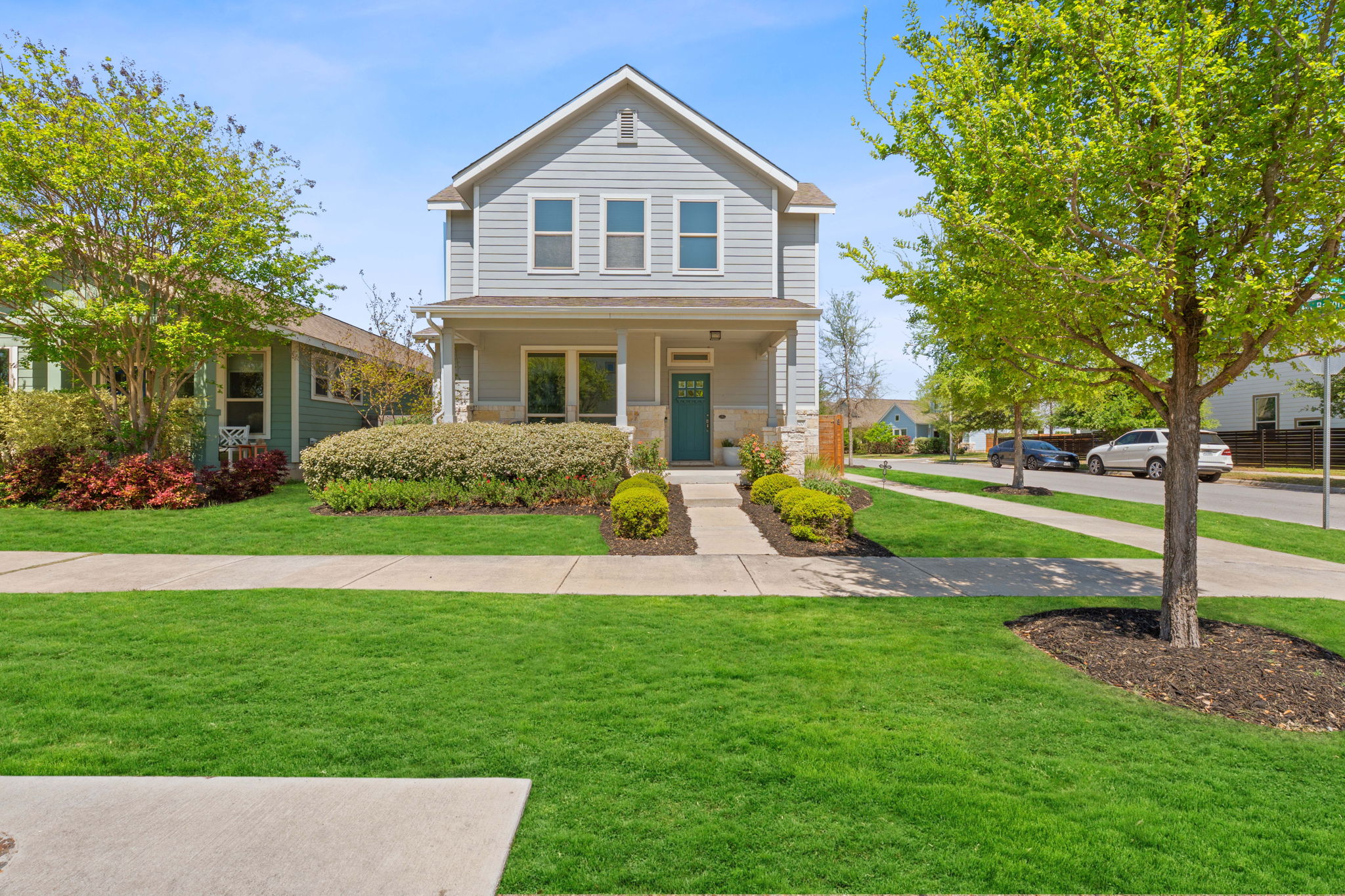 a front view of house with yard and green space