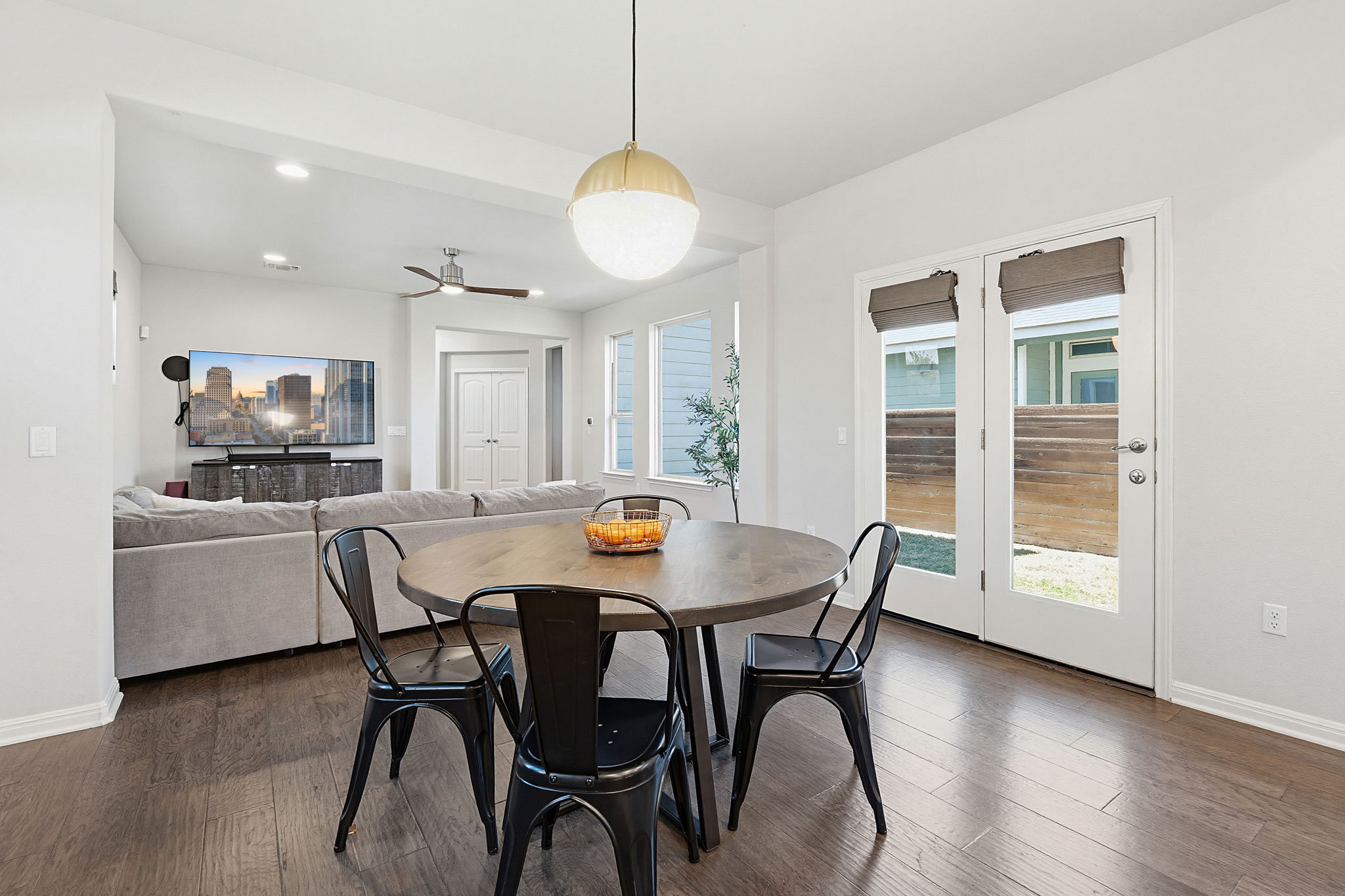 5820 Baythorne Drive Austin, TX 78747 - Photo 13 of 32 a view of a dining room with furniture and wooden floor