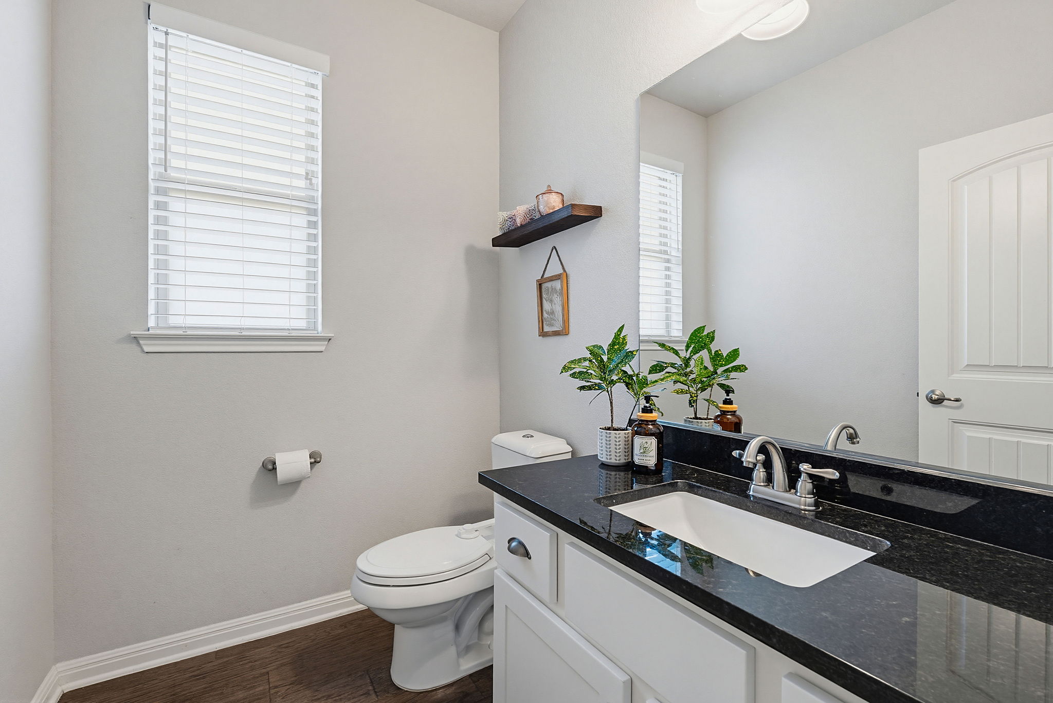 5820 Baythorne Drive Austin, TX 78747 - Photo 20 of 32 a bath room with a sink and a toilet