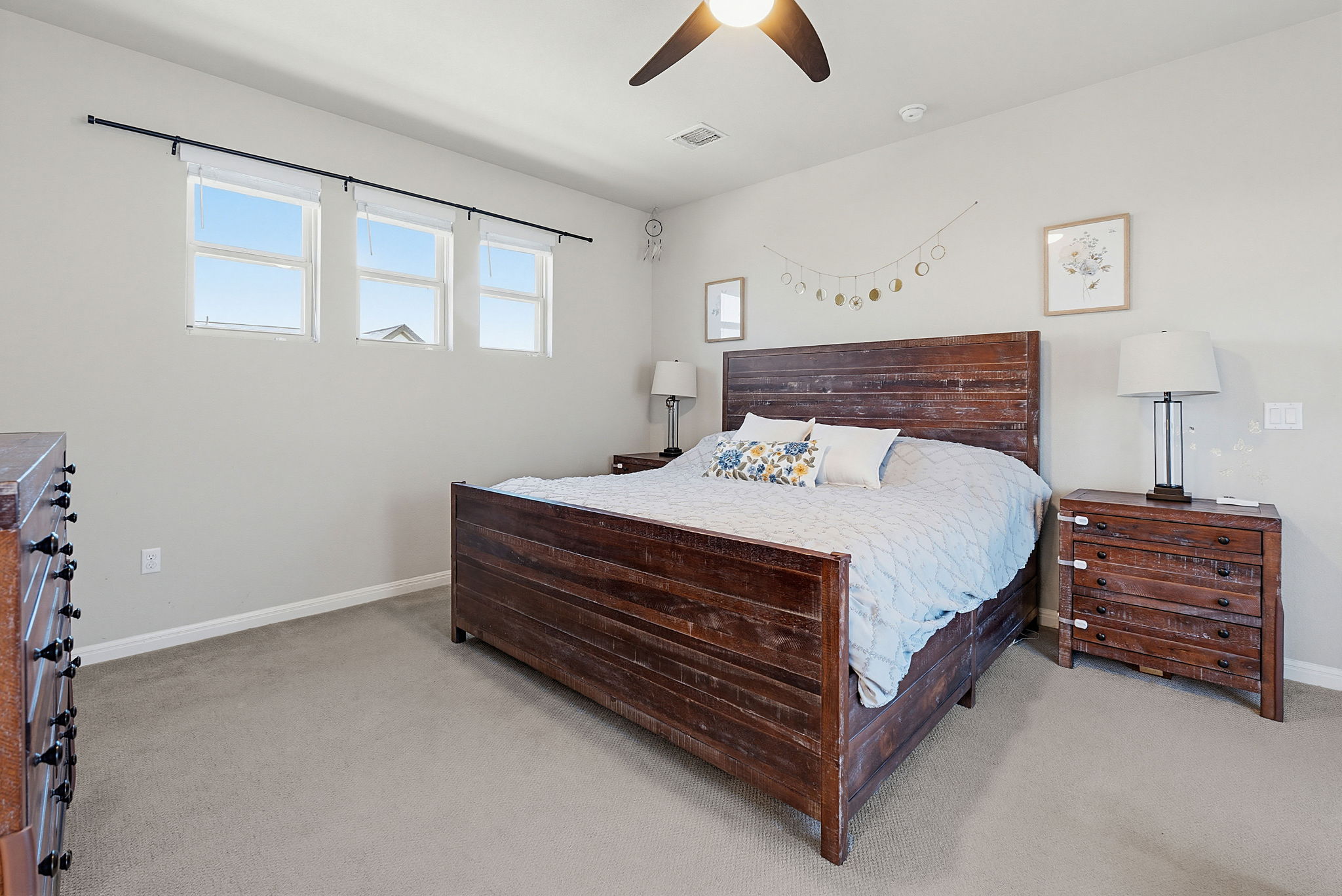 5820 Baythorne Drive Austin, TX 78747 - Photo 21 of 32 a bed room with a bed and a night stand
