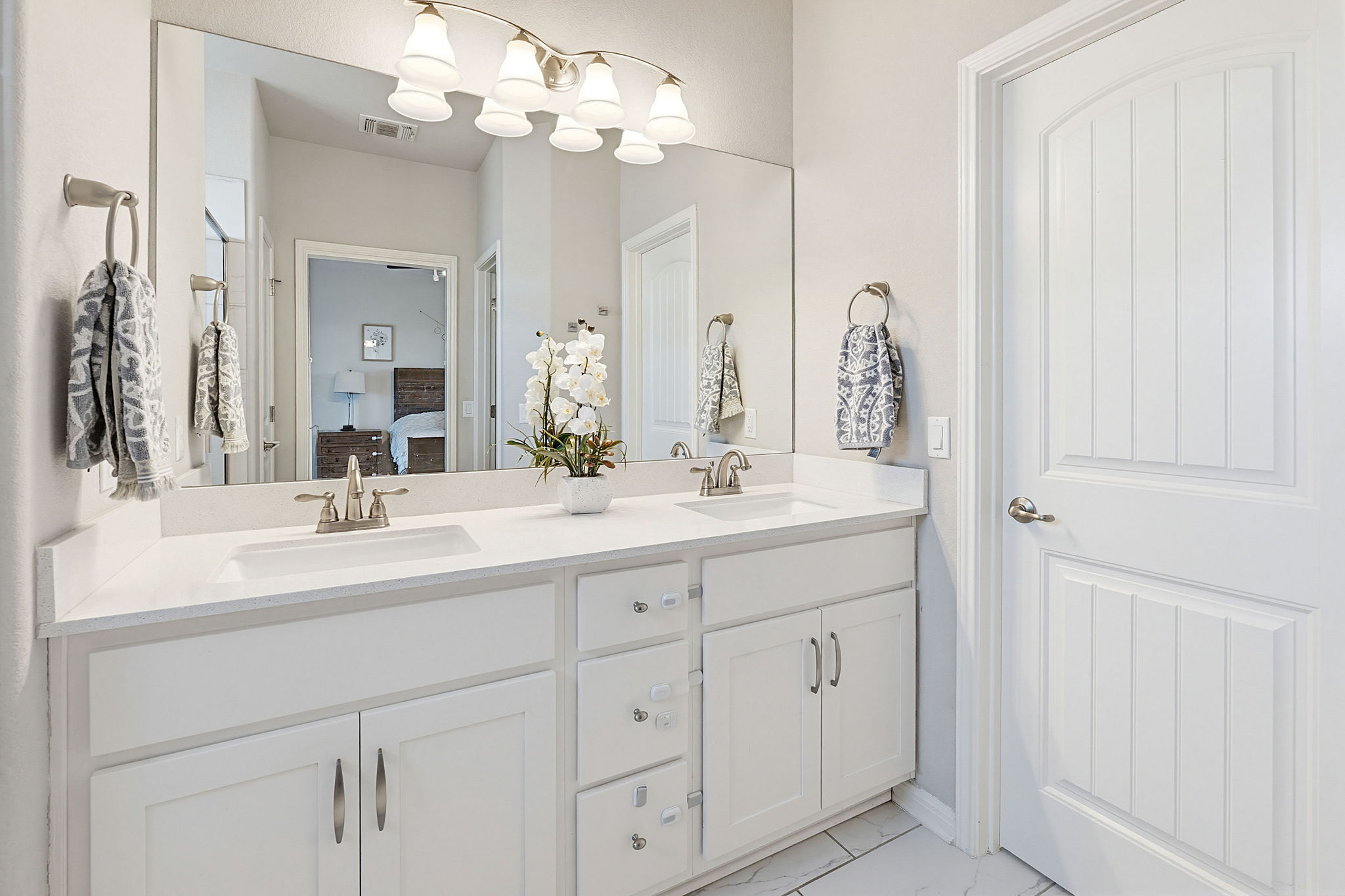 5820 Baythorne Drive Austin, TX 78747 - Photo 23 of 32 a bathroom with a sink vanity and a mirror