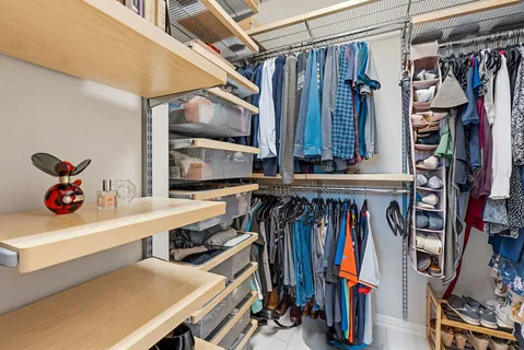 a view of a workspace with furniture and a bookshelf