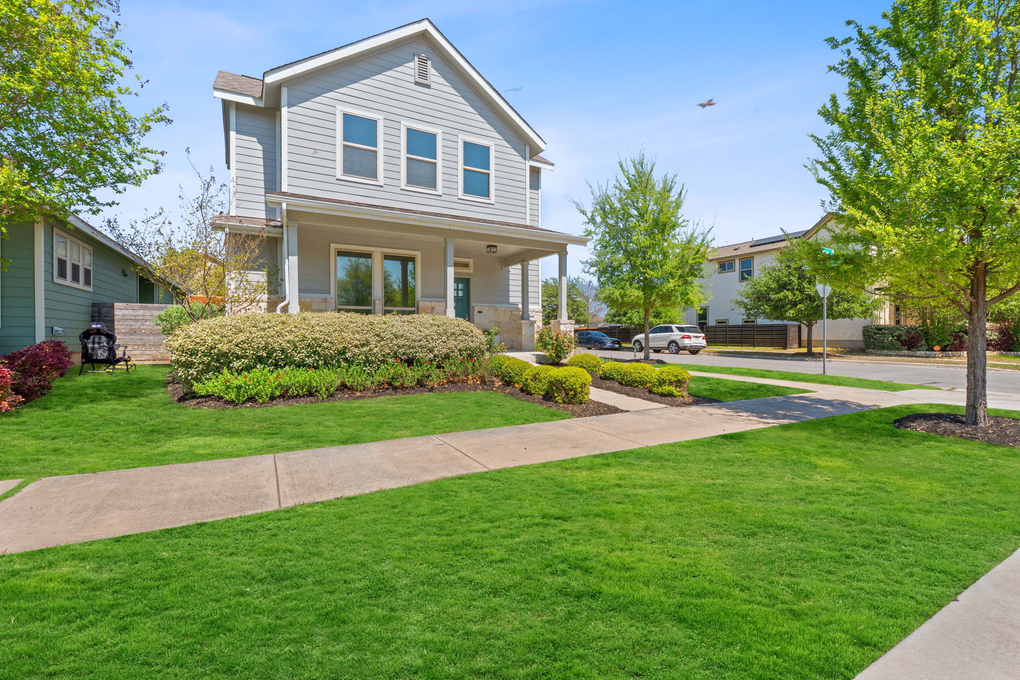 5820 Baythorne Drive Austin, TX 78747 - Photo 27 of 32 a front view of house with yard and green space