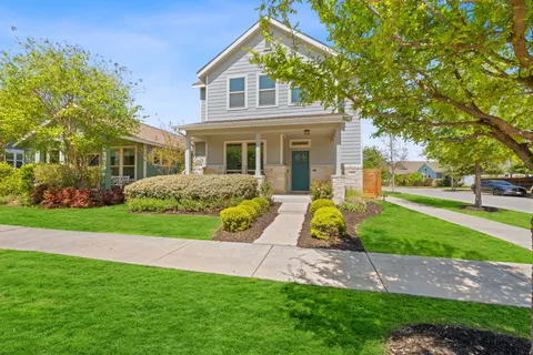 a view of a backyard with wooden fence