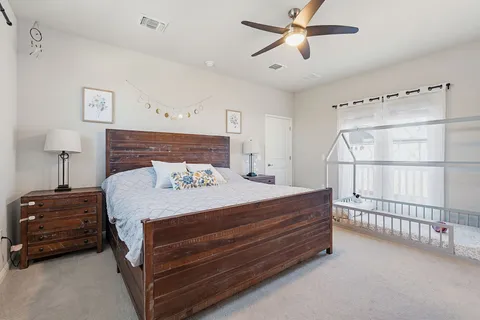 a bedroom with a bed and a chandelier