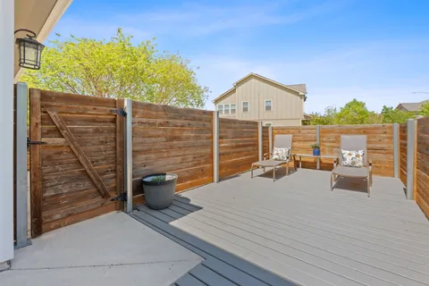 a view of roof deck with patio