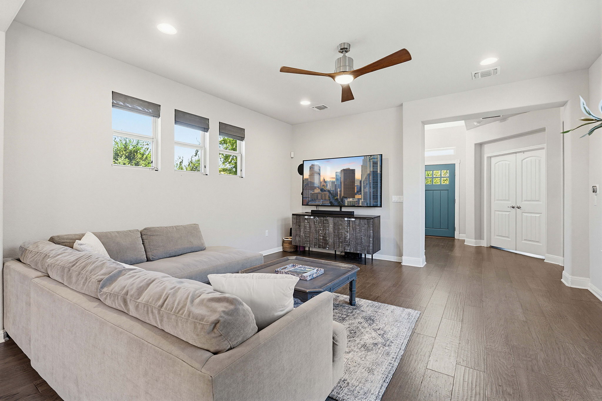 5820 Baythorne Drive Austin, TX 78747 - Photo 10 of 32 a living room with furniture and a wooden floor