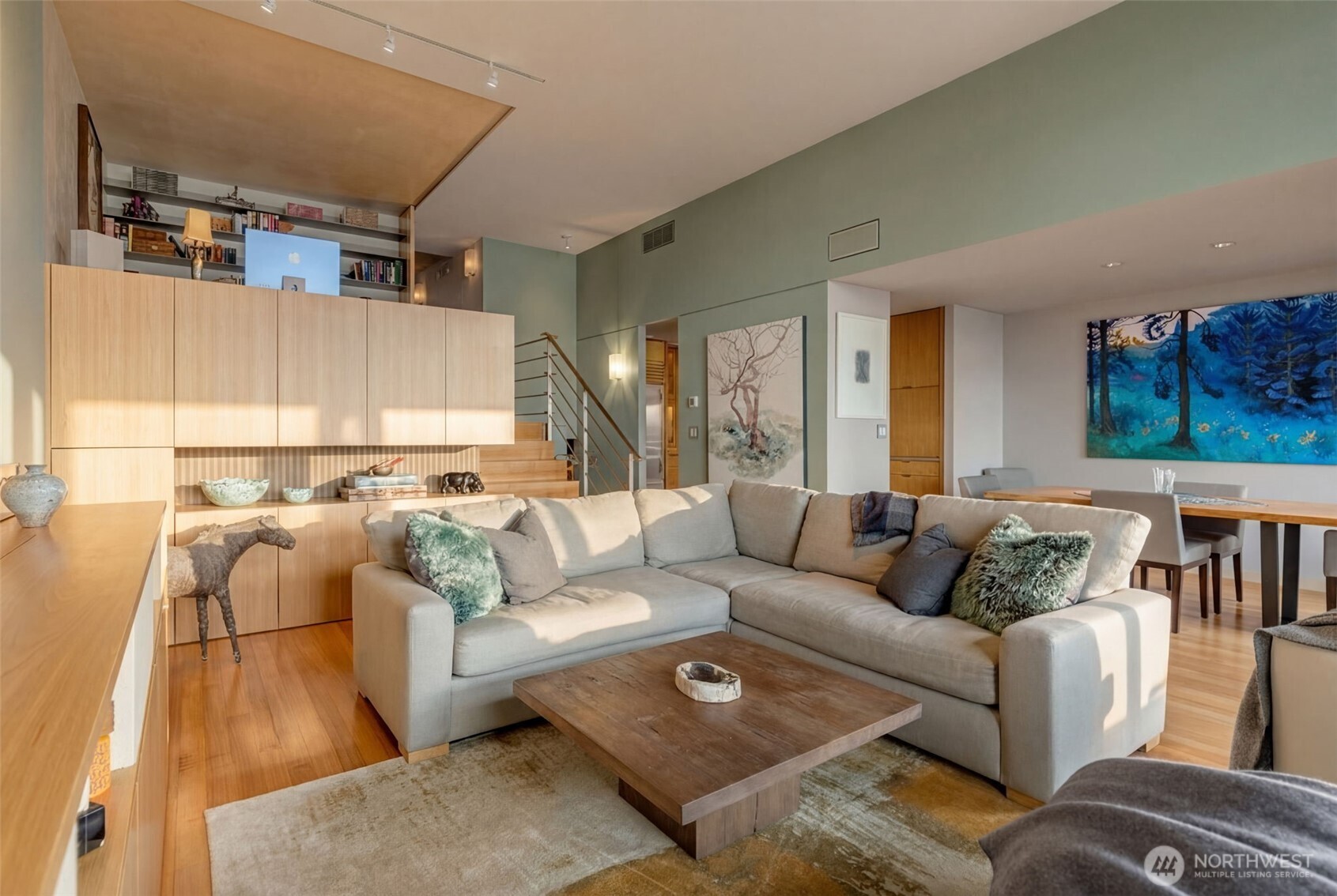 2021 1st Avenue, Unit E8 Seattle, WA 98121 - Photo 13 of 32 a living room with furniture and a couch