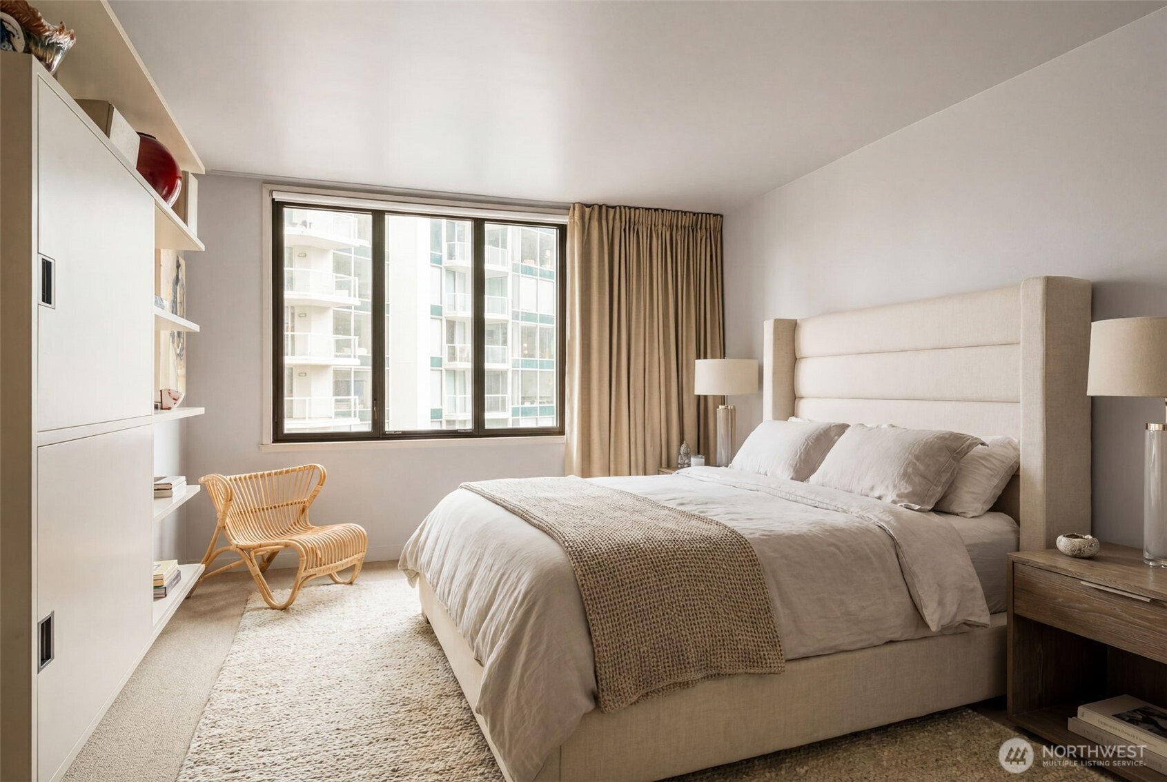 2021 1st Avenue, Unit E8 Seattle, WA 98121 - Photo 21 of 32 a bedroom with a bed and a large window