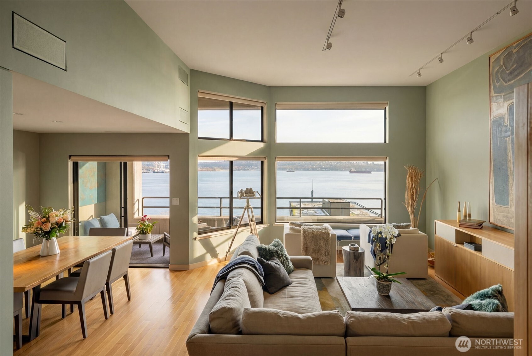 2021 1st Avenue, Unit E8 Seattle, WA 98121 - Photo 6 of 32 a living room with furniture and a large window