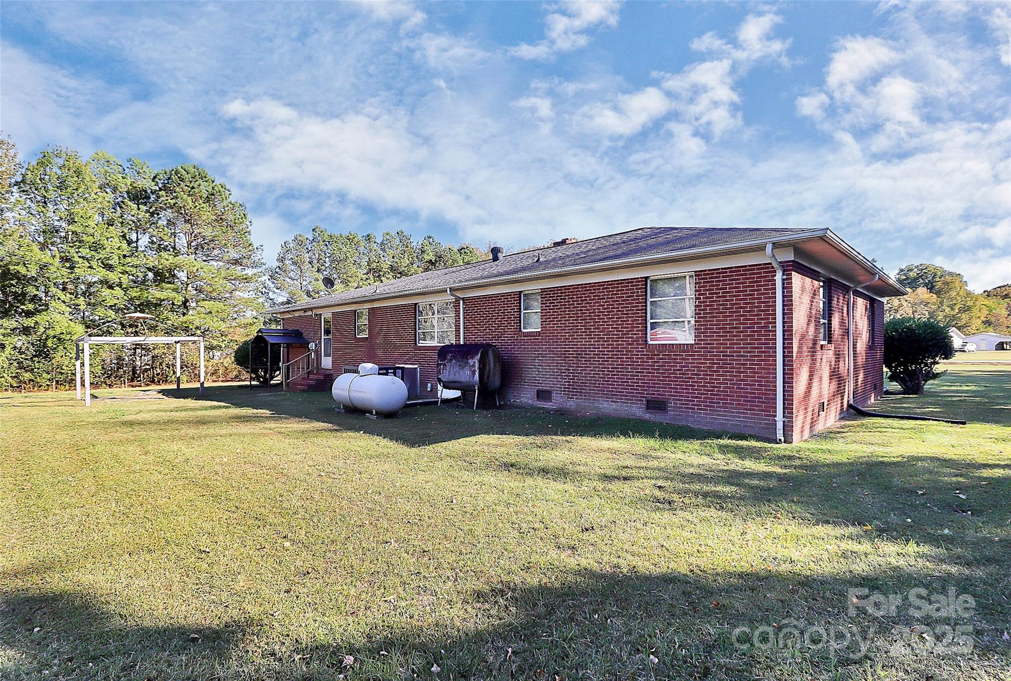 6217 Stack Road Monroe, NC 28112 - Photo 28 of 37 a view of a house with swimming pool and a yard