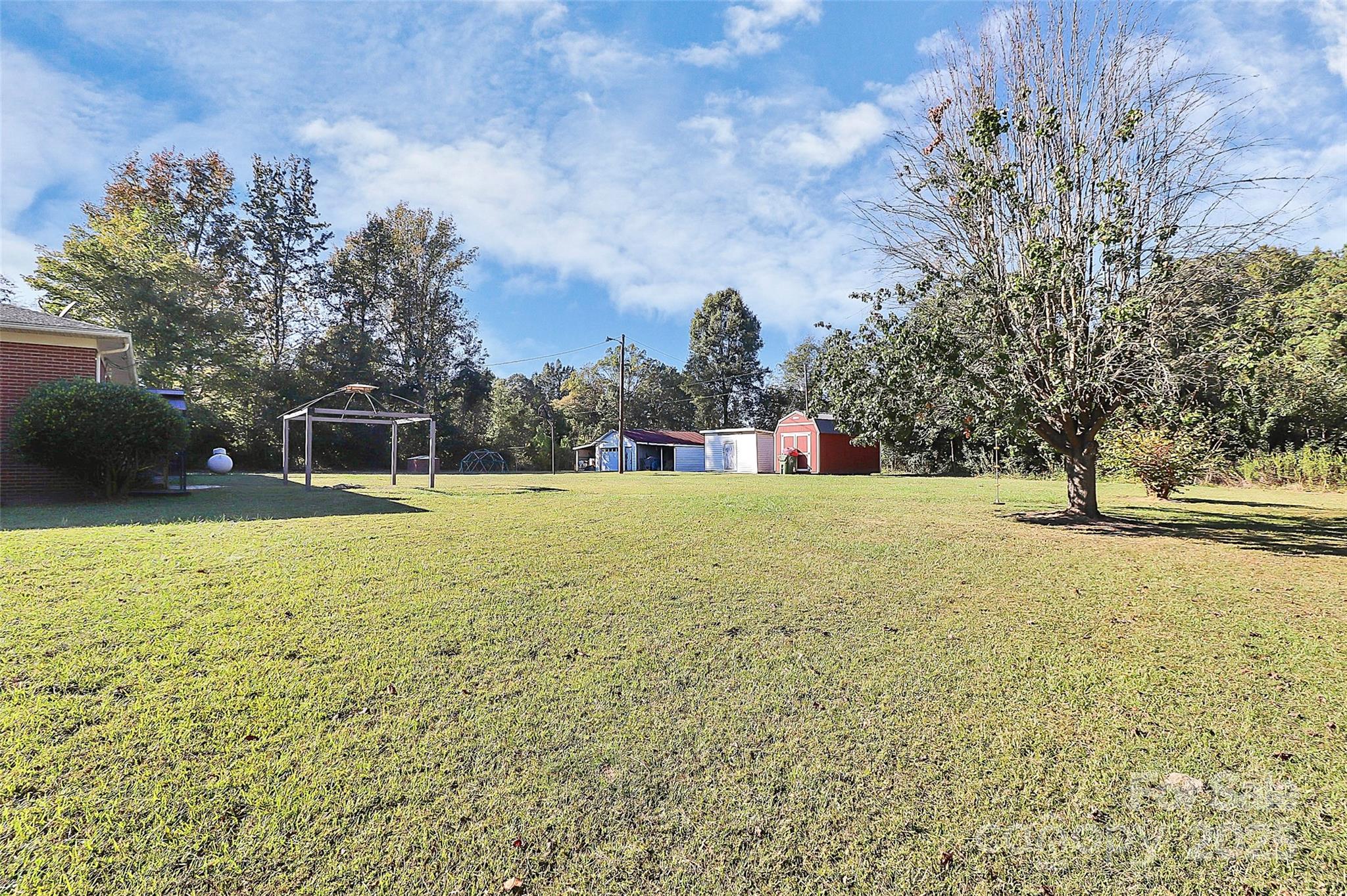6217 Stack Road Monroe, NC 28112 - Photo 30 of 37 a swimming pool with outdoor seating and yard