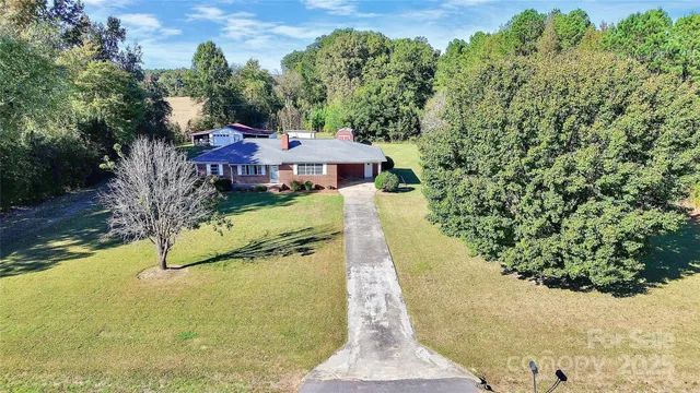 a view of swimming pool with a yard