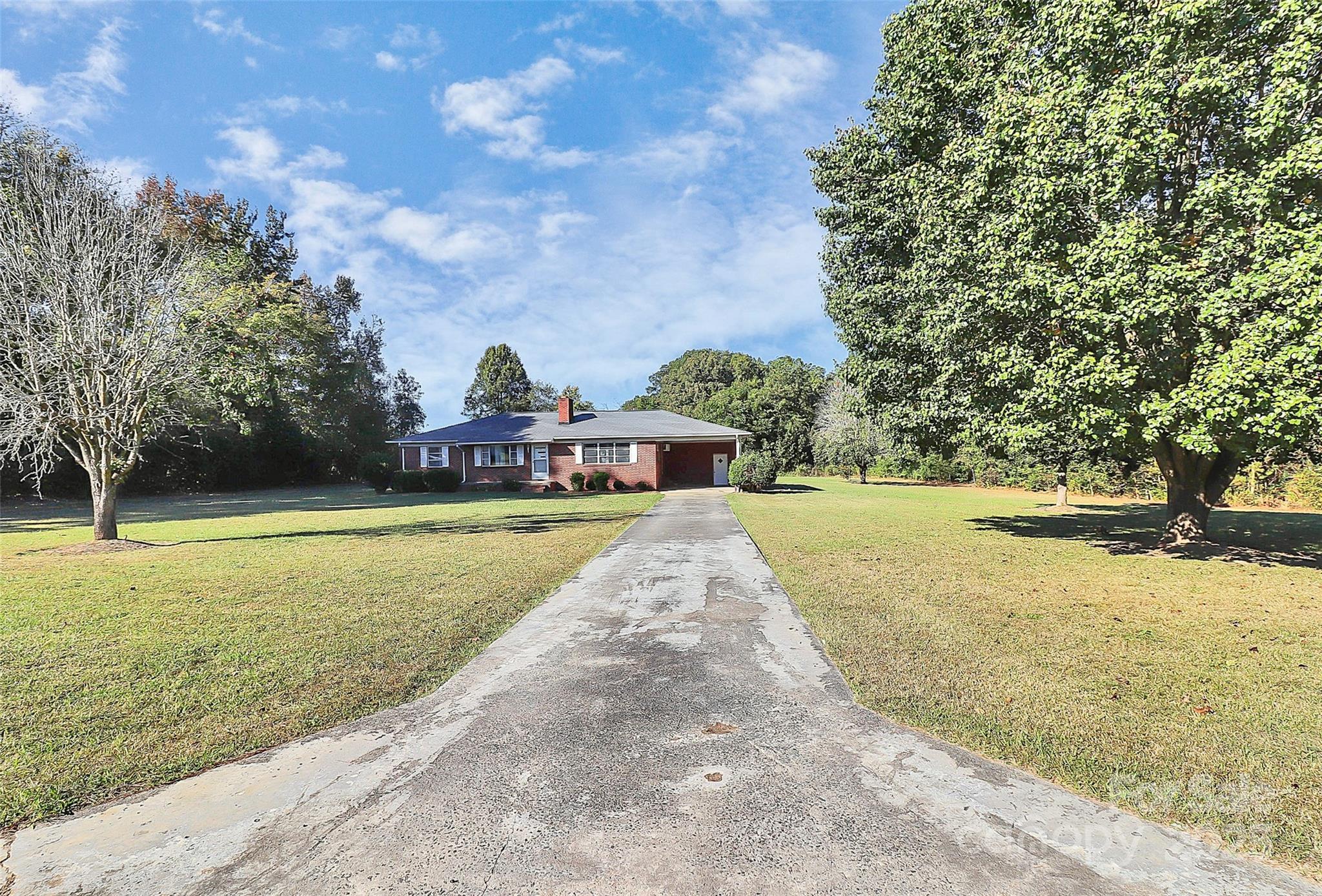 6217 Stack Road Monroe, NC 28112 - Photo 5 of 37 a view of a swimming pool with an outdoor space and seating area