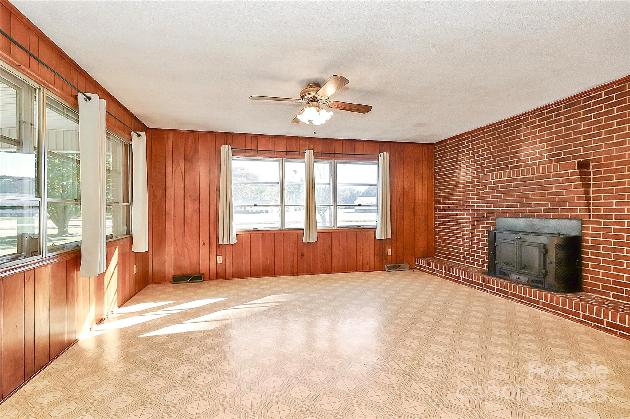 6217 Stack Road Monroe, NC 28112 - Photo 6 of 37 a view of an empty room with a fireplace and a window