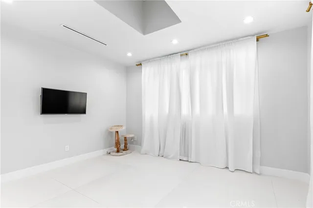 a room with a bed and a night stand