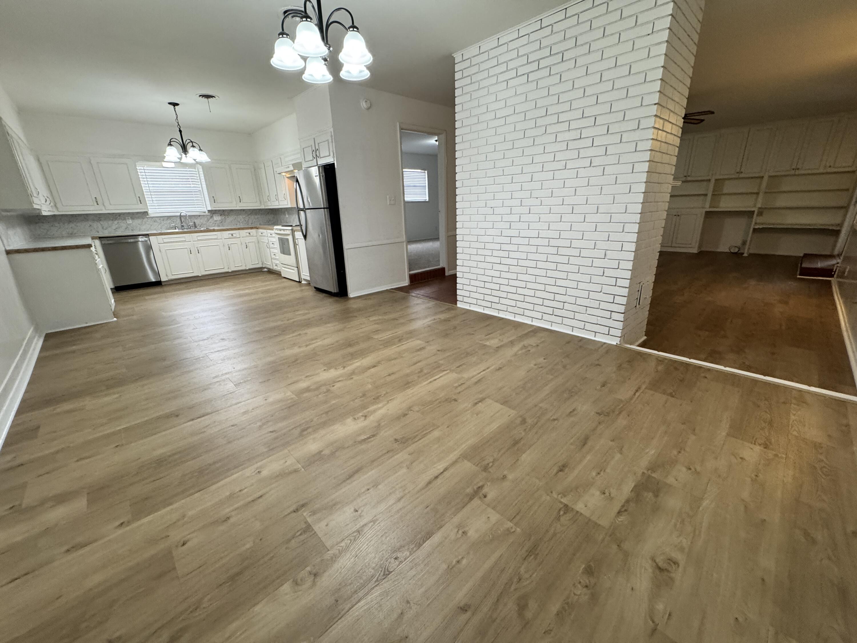 1209 Garland Plainview, TX 79072 - Photo 11 of 38 a view of a livingroom with a chandelier