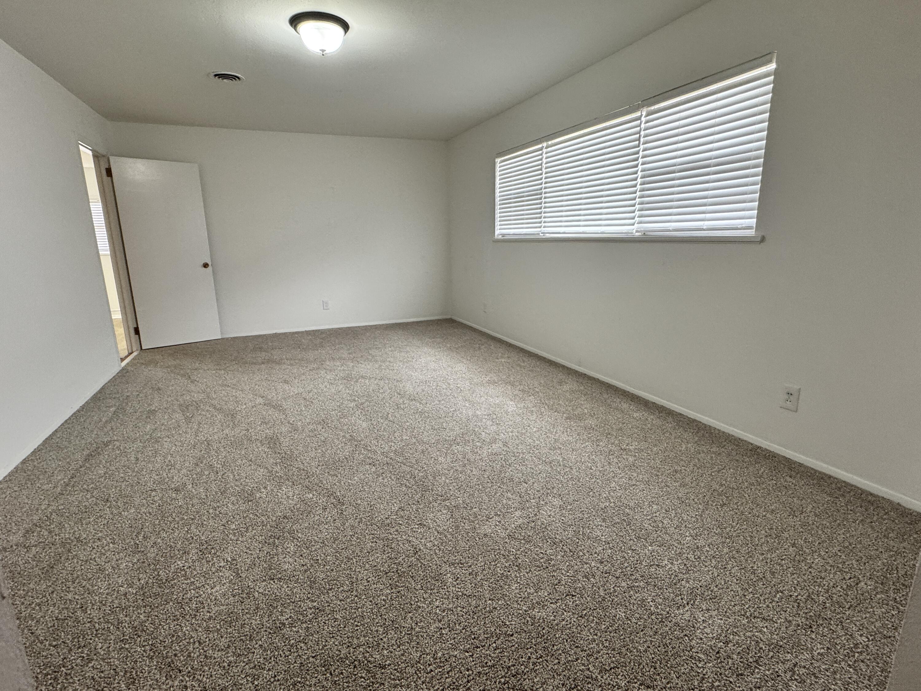 1209 Garland Plainview, TX 79072 - Photo 5 of 38 an empty room with windows