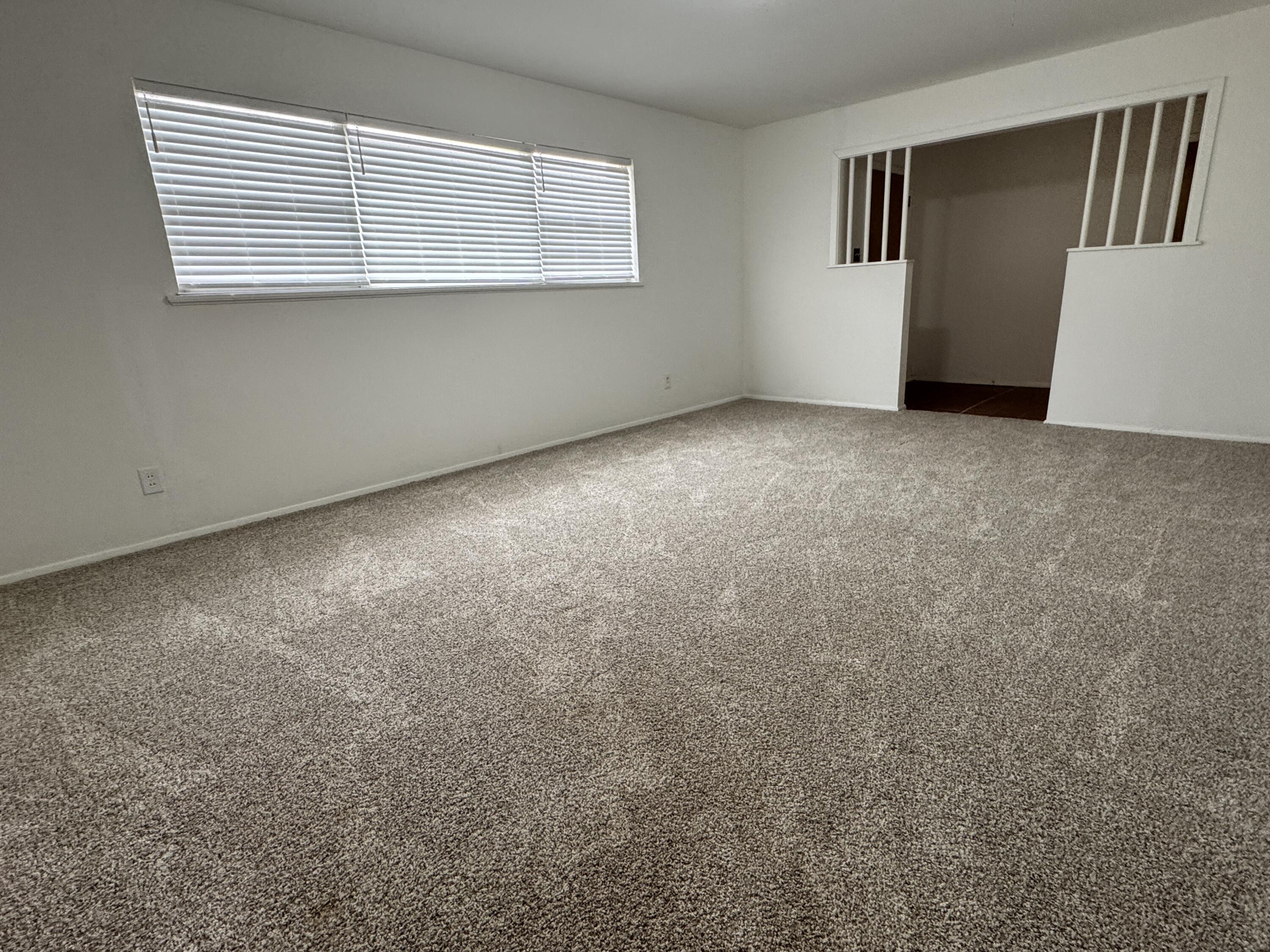 1209 Garland Plainview, TX 79072 - Photo 6 of 38 a view of an empty room with a window