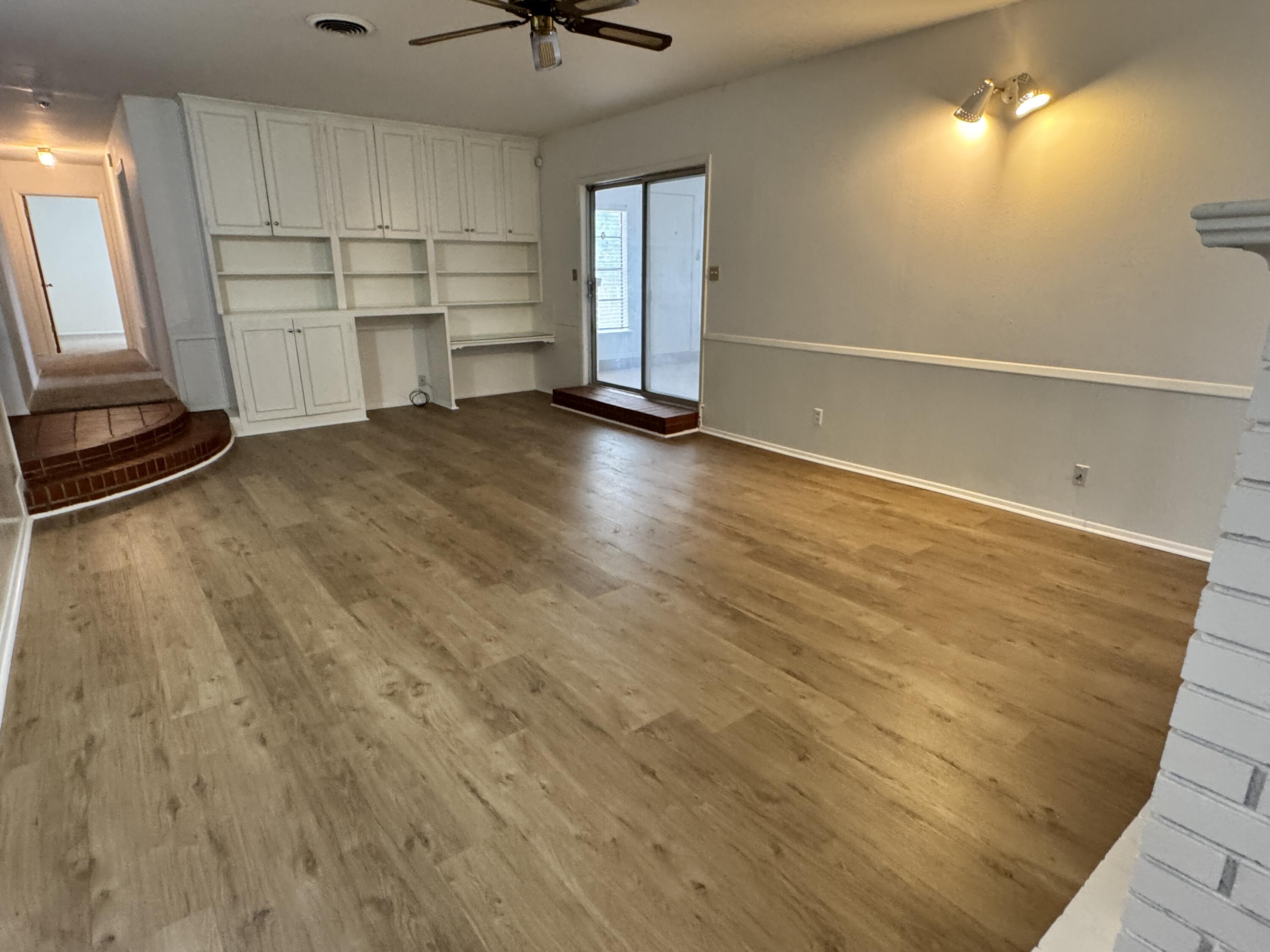 1209 Garland Plainview, TX 79072 - Photo 9 of 38 wooden floor in an empty room