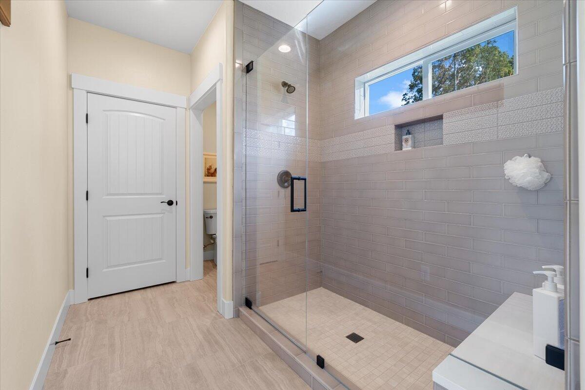 1323 Ellison Loop Merlin, OR 97532 - Photo 14 of 24 Large tile shower. Enclosed toilet room and linen closet.