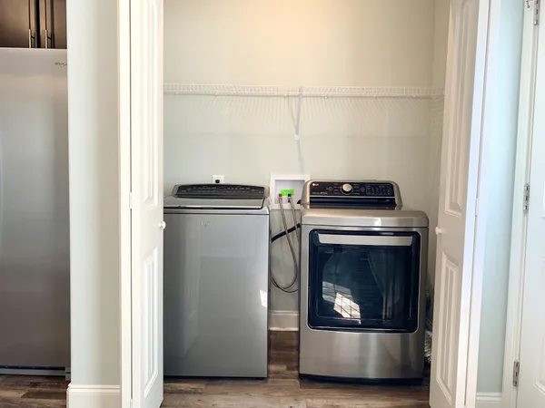 a kitchen with a stove and a refrigerator